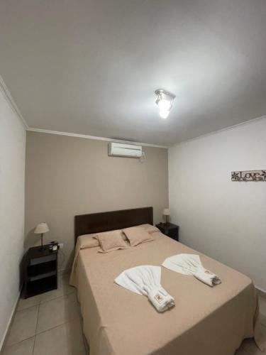 Una cama o camas en una habitación de Ayres de chajari