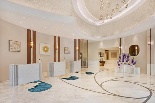 a lobby with a large room with a circular ceiling at DAMAC Maison Distinction in Dubai