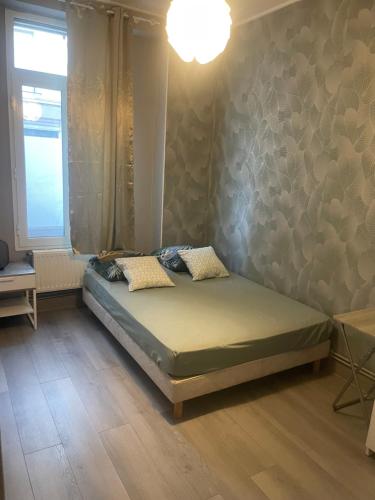 Postel nebo postele na pokoji v ubytování Appartement Familial PARIS PORTE LA VILETTE