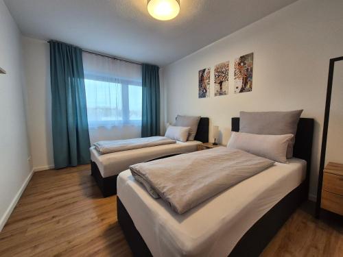 Katil atau katil-katil dalam bilik di Ferienwohnung in Schwieberdingen