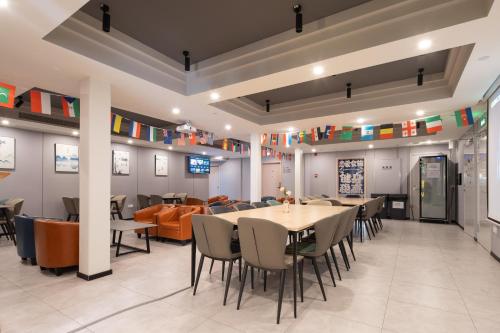 a dining room with a table and chairs at Dayin Youth Hostel - Old Town & People's Square& Rail Hub -Social Area -Bar -Café -Gym -Free Laundry Luggage Storage -24H Front Desk -English Service in Shanghai