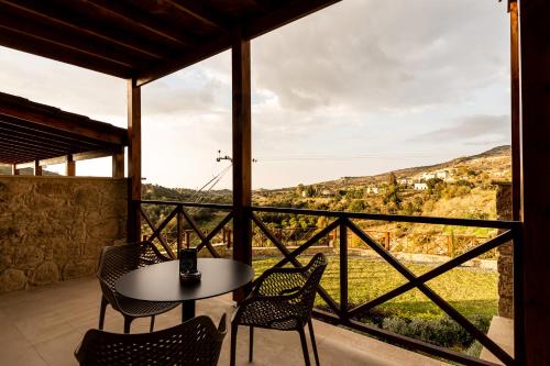 a table and chairs on a balcony with a view at Harma Traditional Boutique Suites in Paphos City