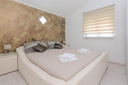 Posteľ alebo postele v izbe v ubytovaní Apartments Lucica