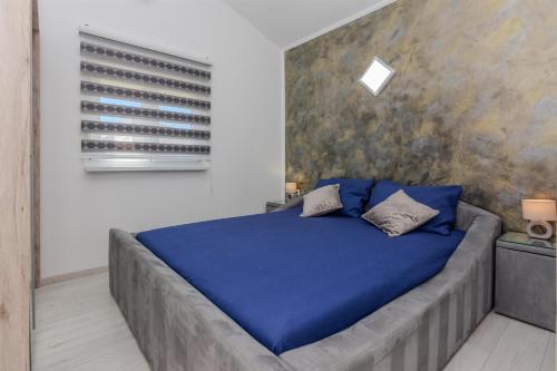 Posteľ alebo postele v izbe v ubytovaní Apartments Lucica