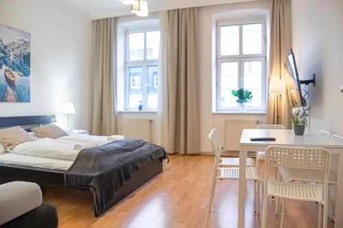 A bed or beds in a room at Delightful 2BR Apt.-Near Wiener Stadthalle