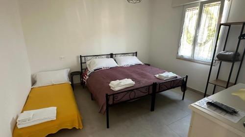 Ένα ή περισσότερα κρεβάτια σε δωμάτιο στο Orte Holiday - Inaugurazione Agosto 2024