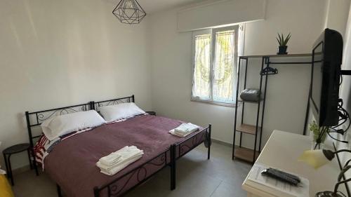 Ένα ή περισσότερα κρεβάτια σε δωμάτιο στο Orte Holiday - Inaugurazione Agosto 2024