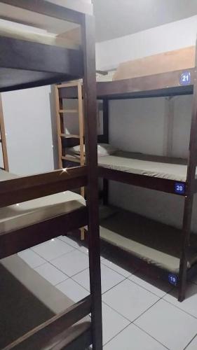 a group of bunk beds in a room at Recanto da Iara in Arraial do Cabo