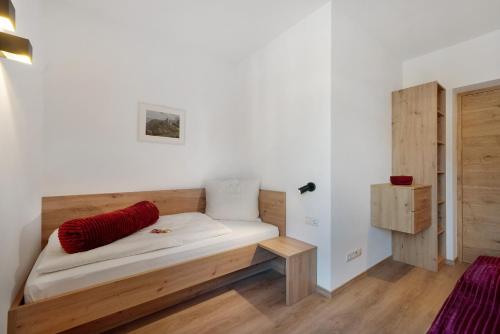 a room with a wooden bench in a room at Apartment Fuchsberger in Lana