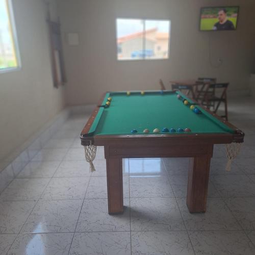 a pool table sitting in a room with at Pousada da Lorena in Itanhaém