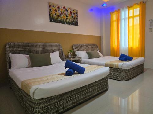 Postel nebo postele na pokoji v ubytování JADE RESORT - Bauang, La Union