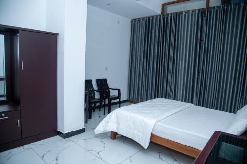 Katil atau katil-katil dalam bilik di Eagle heights Resort