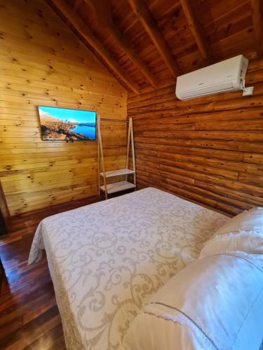 Letto o letti in una camera di Cabañas La Ponderosa