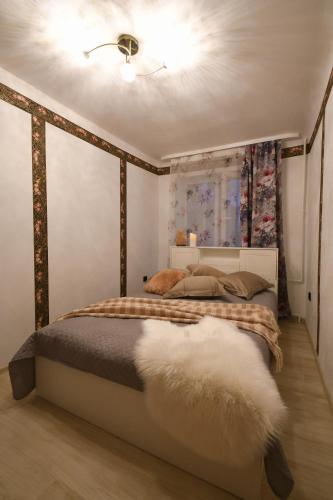Кровать или кровати в номере Ronu apartment