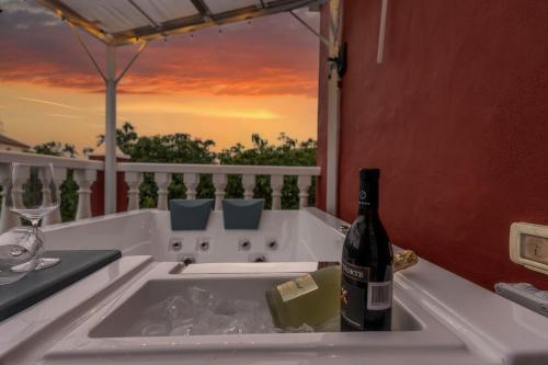 a bottle of wine is sitting in a sink at Luz de Luna in La Rosa