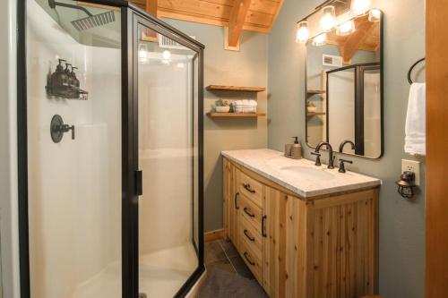 a bathroom with a shower and a sink at Wrap-Around Porch, Hot Tub and Game Room in Blowing Rock
