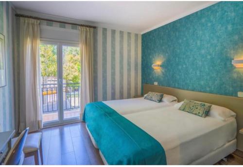 Postel nebo postele na pokoji v ubytování Hotel Esteba