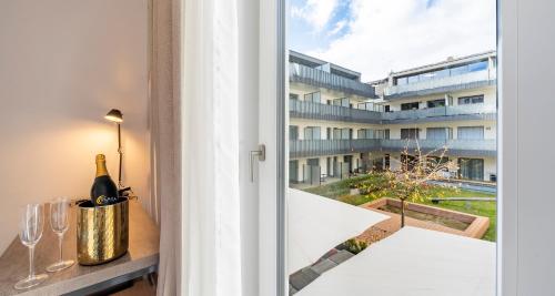 a view from the balcony of a building with a window at Aiden by Best Western Biberach in Biberach an der Riß