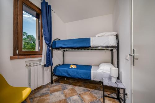 Ένα ή περισσότερα κρεβάτια σε δωμάτιο στο Trinacrys - Casa Vacanze