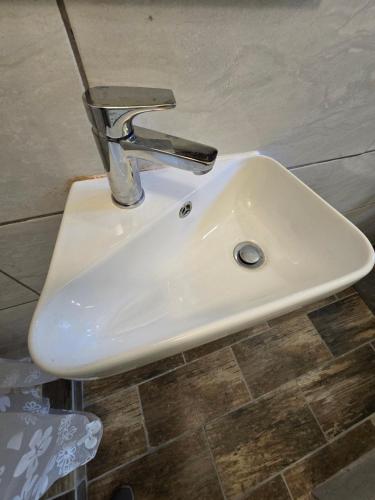a bathroom sink with a faucet on top of it at 55 New Street, Makhanda in Grahamstown