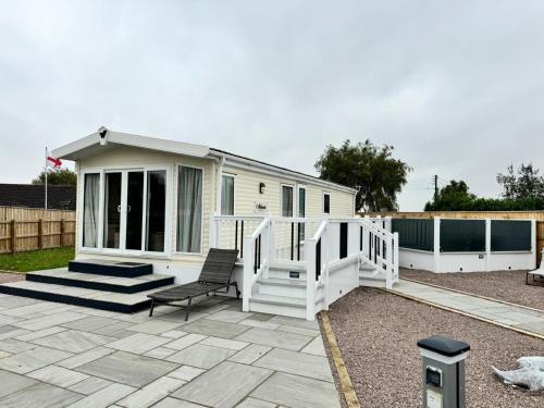 a tiny house with a porch and a patio at The Kings Head inn in Addlethorpe