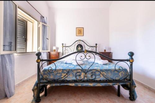 En eller flere senge i et værelse på Almare Casavacanze