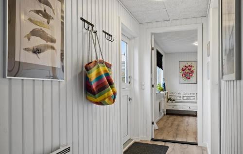 a hallway with a purse hanging on a wall at Cozy Home In Haderslev With Wifi in Haderslev