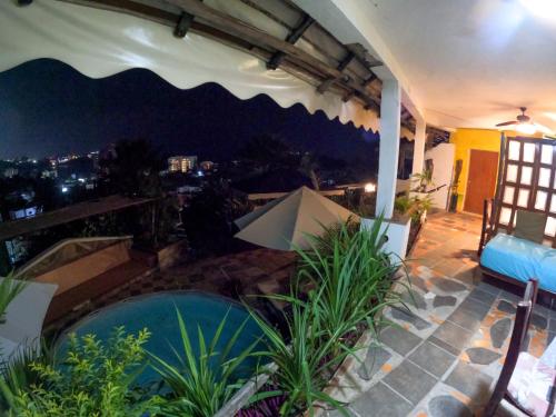 a view of a house with a swimming pool at Casa Artista in Manzanillo