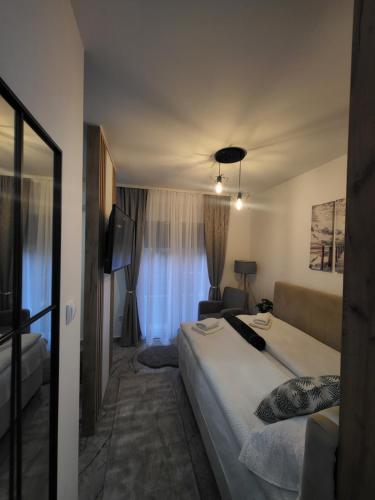 Ένα ή περισσότερα κρεβάτια σε δωμάτιο στο Apartman Karolina