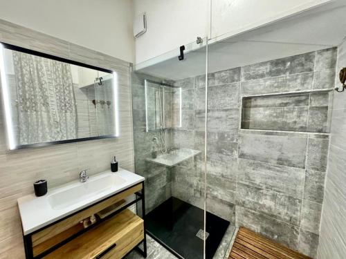 a bathroom with a sink and a shower at Luxury Centre, Cagliari, Sardegna by Home&Experience in Cagliari