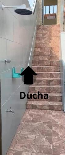 a set of stairs with a sign that reads drina at Apartamento Piuma ES in Piúma