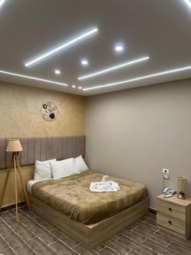 a bedroom with a bed in a room with at PYRAMIDS guest house in Cairo