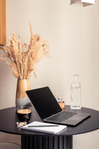 a laptop computer sitting on top of a table at Hôtel Maison Traversière in Paris