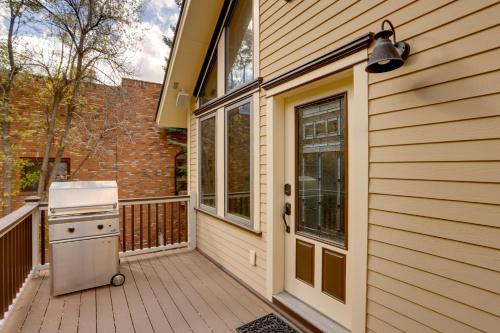 a porch with a stove on a house at On Main Street Ouray Getaway with Mountain Views! in Ouray