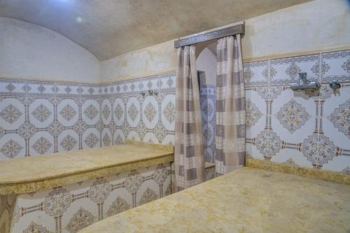 Una cama o camas en una habitación de Riad Jnane Ines