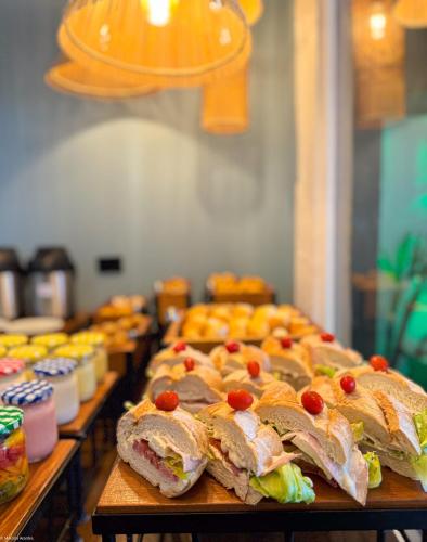 a buffet line of sandwiches and other food items at Chez Pitu Praia Hotel in Búzios