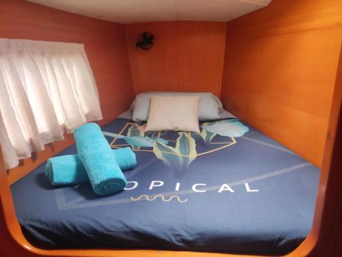 a small room with a bed in a boat at Centro Ibiza Catamaranes y Velero in Ibiza Town