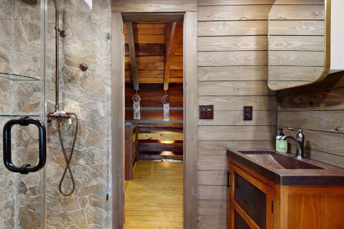 a bathroom with a sink and a shower in a cabin at Goldilocks in Canton