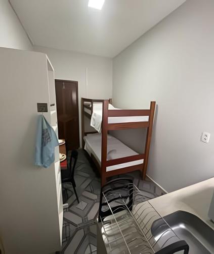 a small room with a bunk bed and a sink at Residencial JC II sua casa em Belém do Pará in Belém