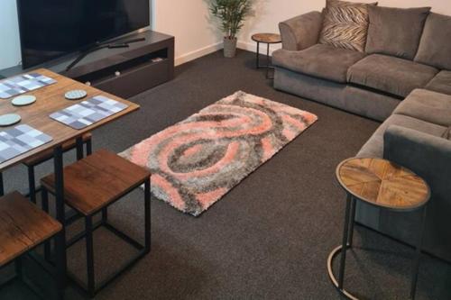a living room with a snake rug on the floor at Cosy Nook - Town centre flat with free nearby parking, in Shrewsbury