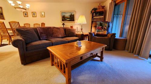 a living room with a couch and a coffee table at Southridge #20 in Harbor Springs