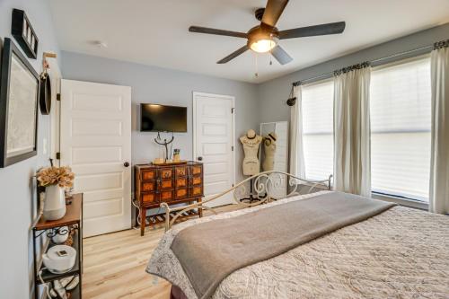 a bedroom with a bed and a ceiling fan at 3 Blocks to Beach and Potomac River Virginia Escape in Colonial Beach