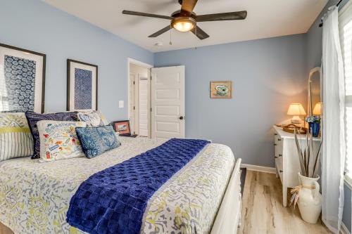 a bedroom with a bed and a ceiling fan at 3 Blocks to Beach and Potomac River Virginia Escape in Colonial Beach