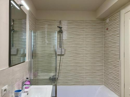 a bathroom with a shower and a tub and a sink at Antico Casale San Pantaleone in Sorbolo