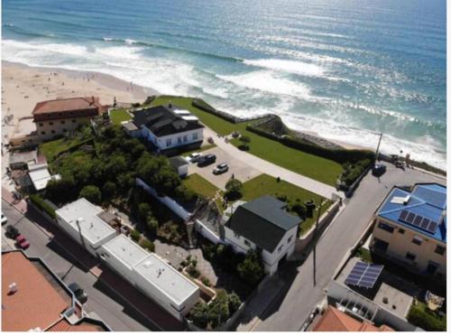 an aerial view of a beach and the ocean at Beach Bungalows - Casal dos Patos - Vila Norte in Lourinhã