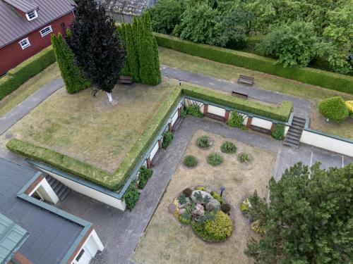 an overhead view of a garden with a park at Jono Pauliaus II piligrimu namai in Raseiniai