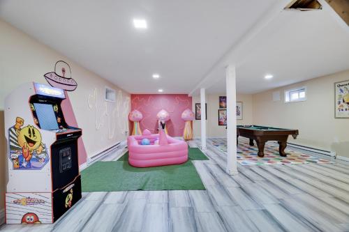 a room with a video game and a pool table at 3BD Stevens Universe Theme - Games - Backyard in Tobyhanna