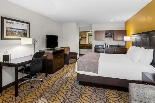 a hotel room with a bed and a desk at Best Western of Harbor Springs in Harbor Springs