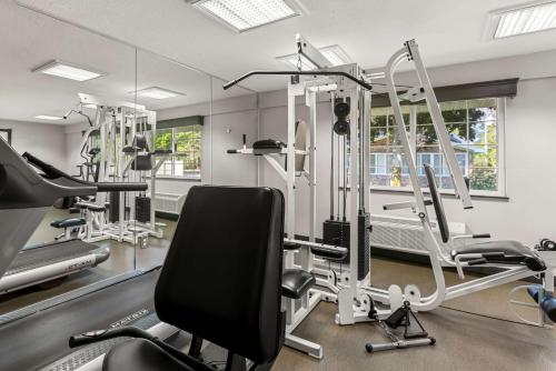 a gym with treadmills and elliptical machines at Best Western of Harbor Springs in Harbor Springs