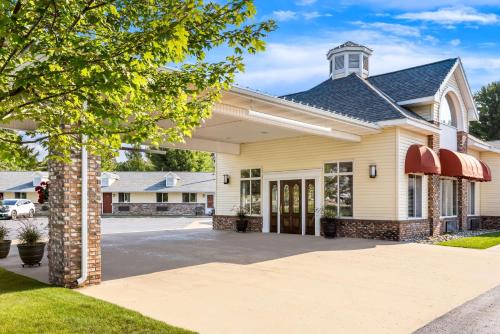 a house with a driveway in front of it at Best Western of Harbor Springs in Harbor Springs